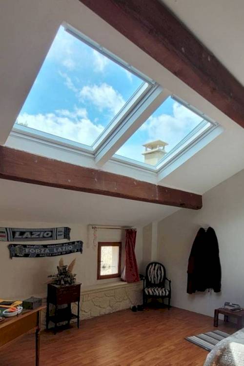 Installation d'une combinaison de fenêtres de toit